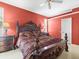 Spacious main bedroom with a large bed and built-in shelving at 5537 Terrain De Golf Dr, Lutz, FL 33558