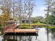 Private lakefront dock with gazebo, offering stunning water views at 5649 Glencrest Blvd, Tampa, FL 33625