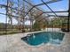 Relaxing screened-in pool overlooking a tranquil lake at 5649 Glencrest Blvd, Tampa, FL 33625