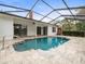 Inviting screened-in pool with a spacious patio area at 5649 Glencrest Blvd, Tampa, FL 33625