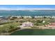 Aerial view of waterfront condo building with access to a private beach at 5700 Escondida S Blvd # 302, St Petersburg, FL 33715