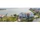 Waterfront condo building with golf course and pond views at 5700 Escondida S Blvd # 302, St Petersburg, FL 33715