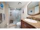 Spa-like bathroom with walk-in shower and granite vanity at 5700 Escondida S Blvd # 302, St Petersburg, FL 33715