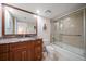 Bathroom with tub shower combo and granite vanity at 5700 Escondida S Blvd # 302, St Petersburg, FL 33715