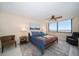 Bedroom with water view, king-size bed, and ceiling fan at 5700 Escondida S Blvd # 302, St Petersburg, FL 33715