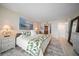 Spacious bedroom with king-size bed and en-suite bathroom access at 5700 Escondida S Blvd # 302, St Petersburg, FL 33715