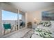 Bedroom with sliding doors to balcony and ocean view at 5700 Escondida S Blvd # 302, St Petersburg, FL 33715