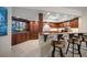 Well-equipped kitchen with dark wood cabinets and granite counters at 5700 Escondida S Blvd # 302, St Petersburg, FL 33715