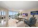 Bright living room featuring water views and comfy furniture at 5700 Escondida S Blvd # 302, St Petersburg, FL 33715