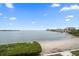 Stunning view of the waterfront and sandy beach at 5700 Escondida S Blvd # 302, St Petersburg, FL 33715