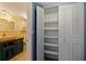 White built-in shelving and extra storage at 6020 Shore S Blvd # 411, Gulfport, FL 33707