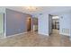 Living room with tile floors and views into kitchen and hallway at 6020 Shore S Blvd # 411, Gulfport, FL 33707