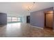 Living room with tile floor, chandelier, and sliding doors at 6020 Shore S Blvd # 411, Gulfport, FL 33707