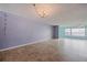 Spacious living room with tile flooring, light blue walls, and water views at 6020 Shore S Blvd # 411, Gulfport, FL 33707