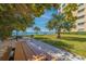 Relaxing waterfront picnic area with tables and grills at 6020 Shore S Blvd # 411, Gulfport, FL 33707