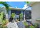 Charming back patio with potted plants and a screened enclosure at 6120 Watercolor Dr, Lithia, FL 33547