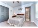 Bright bedroom with double bed, ensuite bathroom, and wood floors at 6120 Watercolor Dr, Lithia, FL 33547