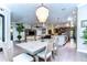 Open concept dining area with a view into the kitchen and living room at 6120 Watercolor Dr, Lithia, FL 33547