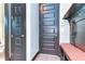 Convenient entryway with built-in bench, storage, and coat hooks at 6120 Watercolor Dr, Lithia, FL 33547