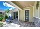 Inviting front porch with paver patio and seating at 6120 Watercolor Dr, Lithia, FL 33547