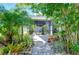 Landscaped patio with walkway to private, screened patio at 6120 Watercolor Dr, Lithia, FL 33547