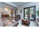 Living area with leather furniture and French doors at 6120 Watercolor Dr, Lithia, FL 33547