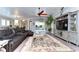 Open living space with leather sectional and large TV at 6120 Watercolor Dr, Lithia, FL 33547
