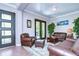 Spacious living room with leather furniture and hardwood floors at 6120 Watercolor Dr, Lithia, FL 33547