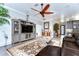 Living room with sectional sofa and large TV at 6120 Watercolor Dr, Lithia, FL 33547