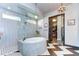 Spa-like Primary bathroom with a circular tub and frameless shower at 6120 Watercolor Dr, Lithia, FL 33547