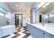 Luxurious Primary bathroom with a soaking tub, walk-in shower, and double vanity at 6120 Watercolor Dr, Lithia, FL 33547
