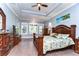 Spacious main bedroom with hardwood floors and a ceiling fan at 6120 Watercolor Dr, Lithia, FL 33547