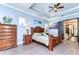 Main bedroom with large windows, wood floors, and ensuite bathroom at 6120 Watercolor Dr, Lithia, FL 33547