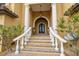 Elegant entryway with brick steps, white columns, and ornate double doors at 6408 Bright Bay Ct, Apollo Beach, FL 33572