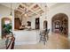 Large kitchen island with seating and views into the hallway at 6408 Bright Bay Ct, Apollo Beach, FL 33572