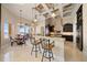 Gourmet kitchen with granite counters, custom cabinetry, and breakfast bar at 6408 Bright Bay Ct, Apollo Beach, FL 33572