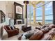 Spacious living room with high ceilings, fireplace, and waterfront views at 6408 Bright Bay Ct, Apollo Beach, FL 33572