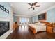 Spacious main bedroom with water views, fireplace, and hardwood floors at 6408 Bright Bay Ct, Apollo Beach, FL 33572