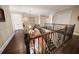 Upstairs hallway with hardwood floors and elegant railings at 6408 Bright Bay Ct, Apollo Beach, FL 33572