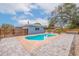 Inviting kidney-shaped pool with patio, pergola, and outdoor kitchen at 674 61St S Ave, St Petersburg, FL 33705