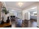 Open dining area with dark hardwood floors and a view into the kitchen at 674 61St S Ave, St Petersburg, FL 33705