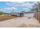 Light blue house with a white garage door and driveway at 674 61St S Ave, St Petersburg, FL 33705