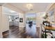 Open concept kitchen with gray cabinets and stainless steel appliances, flows into living and dining area at 674 61St S Ave, St Petersburg, FL 33705