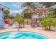 Relaxing patio with pergola, seating, and pool access at 674 61St S Ave, St Petersburg, FL 33705