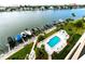 Aerial view of waterfront property with pool and boat slips at 690 Island Way # 410, Clearwater Beach, FL 33767