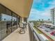 Balcony with table and chairs overlooking city views at 690 Island Way # 410, Clearwater Beach, FL 33767