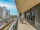 Spacious balcony with seating and partial ocean view at 690 Island Way # 410, Clearwater Beach, FL 33767