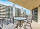 Private balcony with table and chairs, overlooking cityscape at 690 Island Way # 410, Clearwater Beach, FL 33767