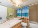 Bathroom with tub, shower, and beach-themed decor at 690 Island Way # 410, Clearwater Beach, FL 33767