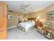 Comfortable bedroom with a ceiling fan and access to balcony at 690 Island Way # 410, Clearwater Beach, FL 33767